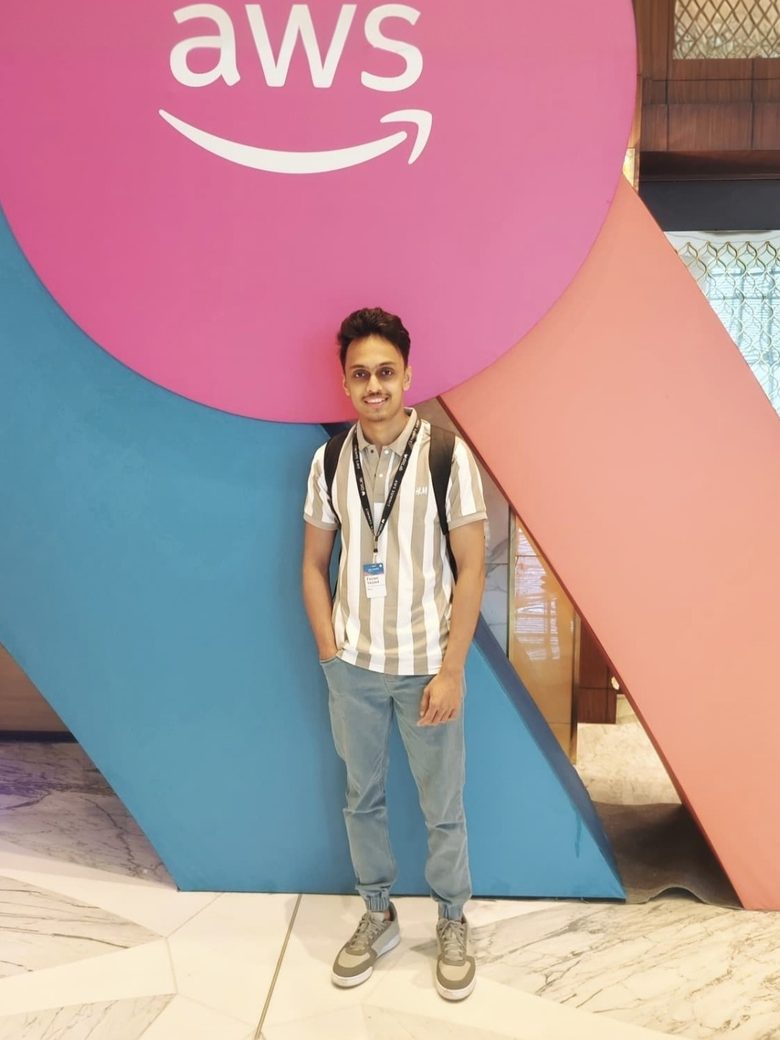 MazeQube team member at the AWS Summit welcome wall