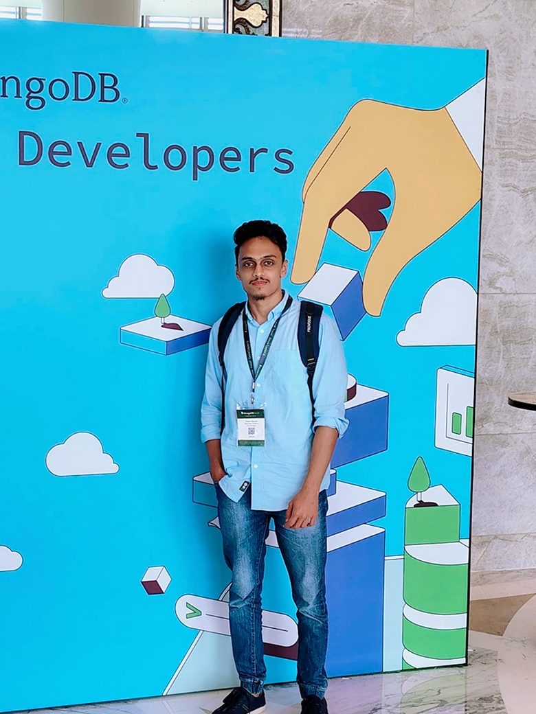 MazeQube team member at the MongoDB.local Love Your Developers wall